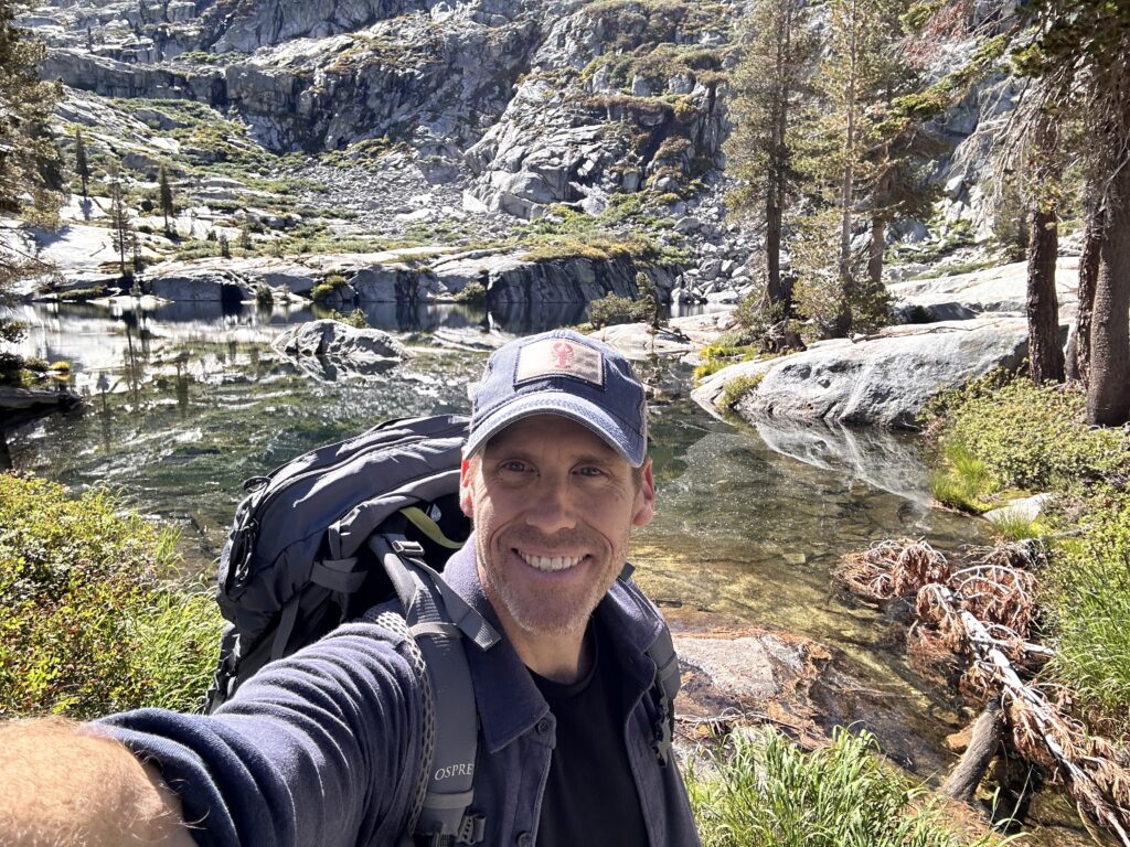 Ryan Crownholm backpacking in the wilderness